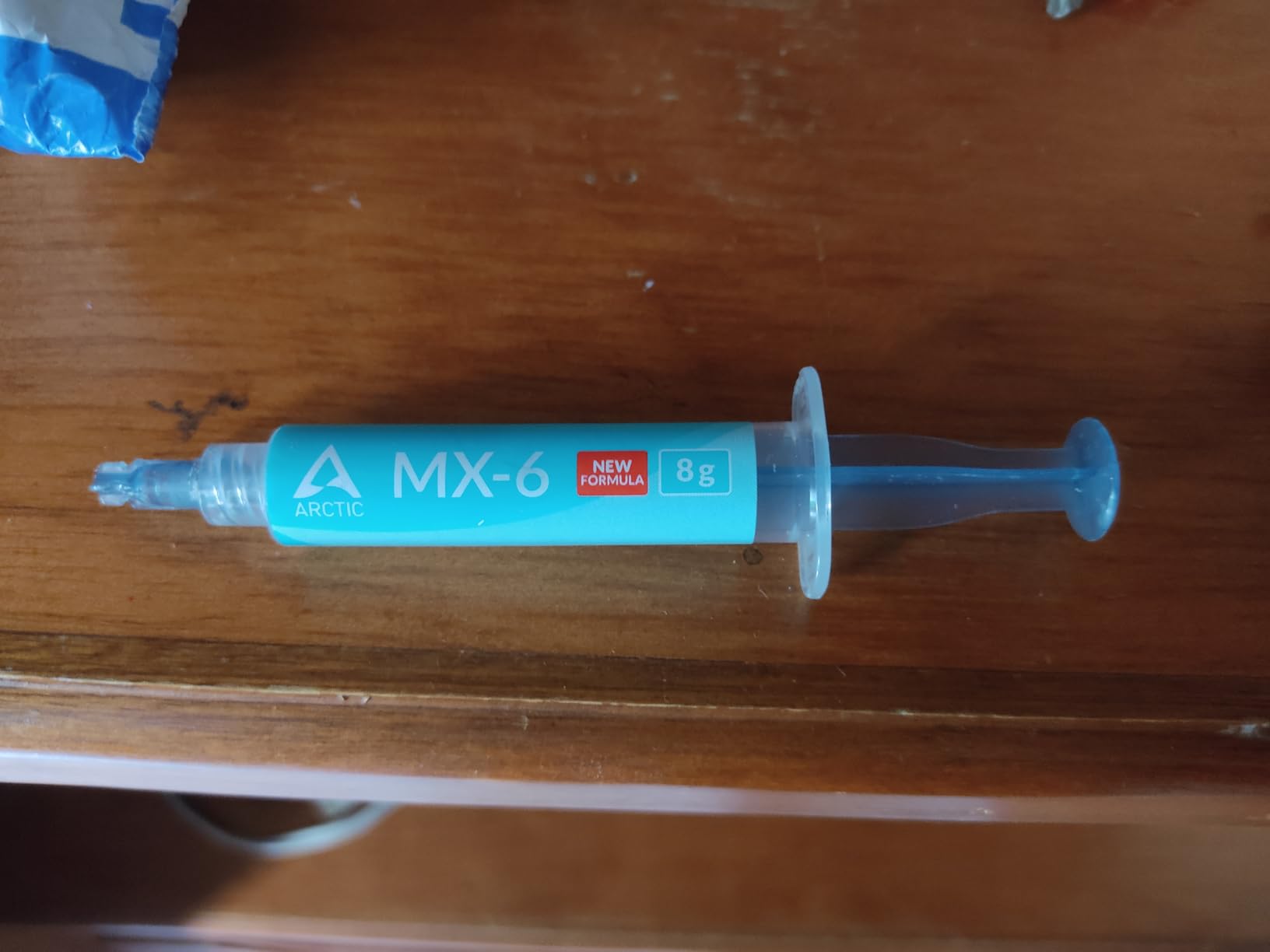 ARCTIC MX-6 (8 g) - Ultimate Performance Thermal Paste for CPU, Consoles, Graphics Cards, laptops, Very high Thermal Conductivity, Long Durability, Non-Conductive customer photo 1