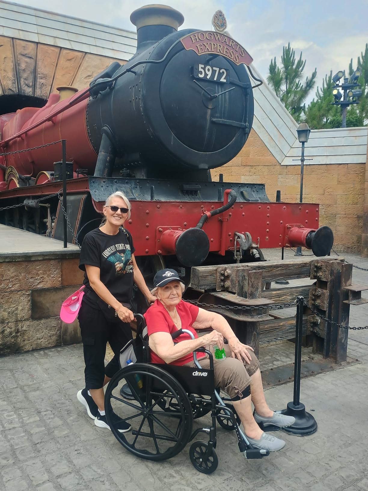 Drive Medical Silver Sport 1 Folding Transport Wheelchair, Black | Lightweight Folding Wheelchair Features Full Armrests and Removable Swing-Away Footrests customer photo 1